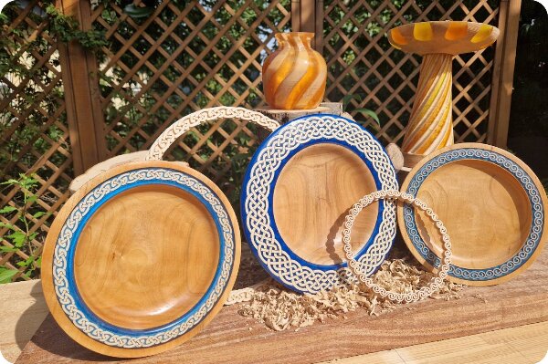 Row of wood turned objects in the sun